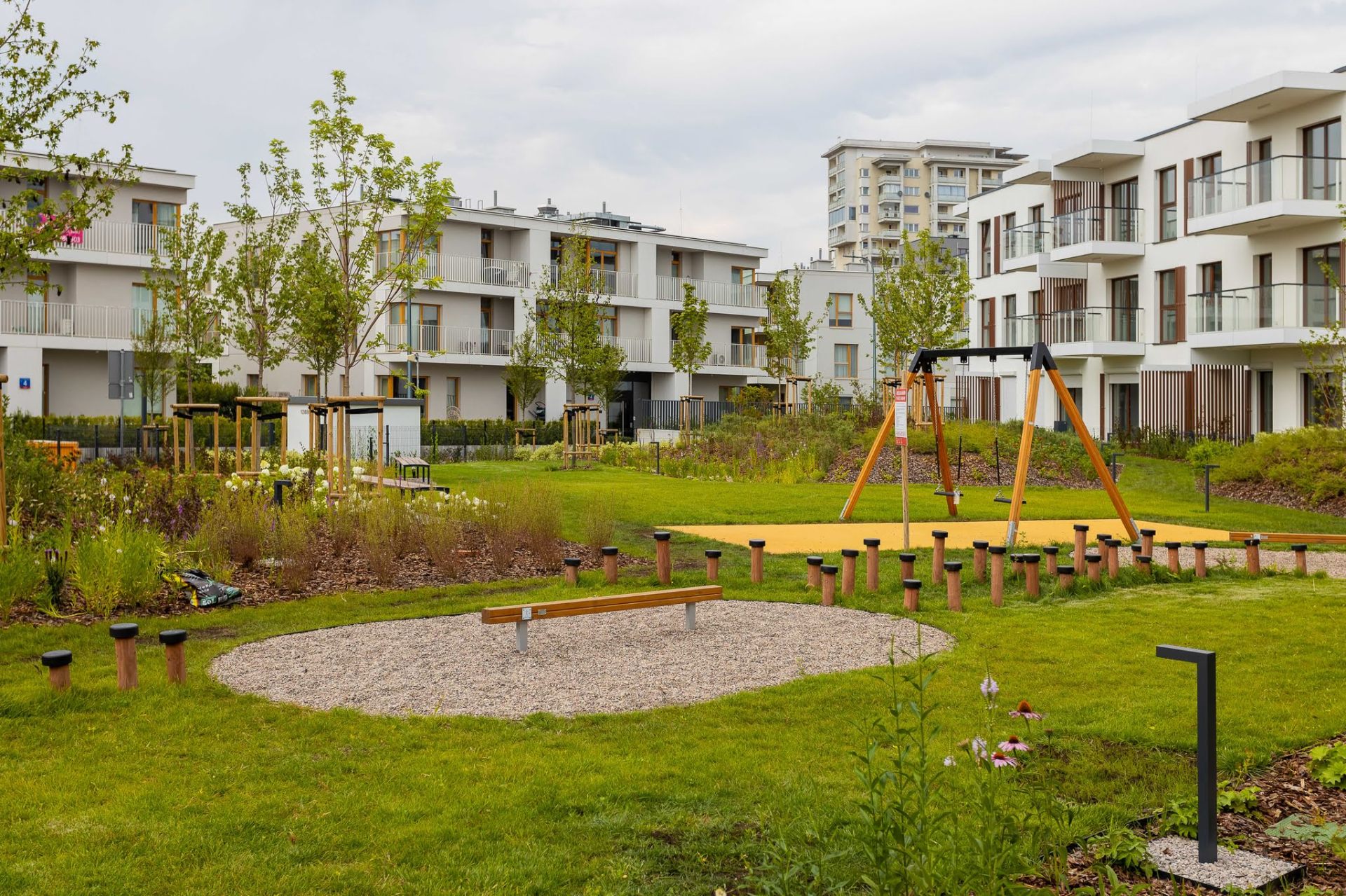 School playground area with wooden swings and balance course for a Kuwait educational facility